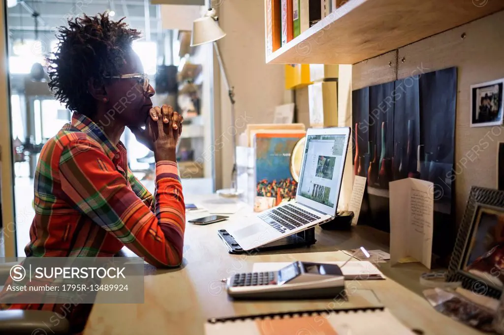 Woman using laptop in office