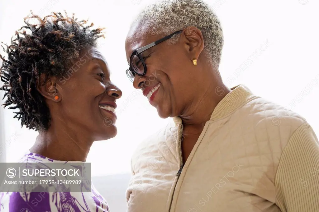 Smiling women looking into eyes