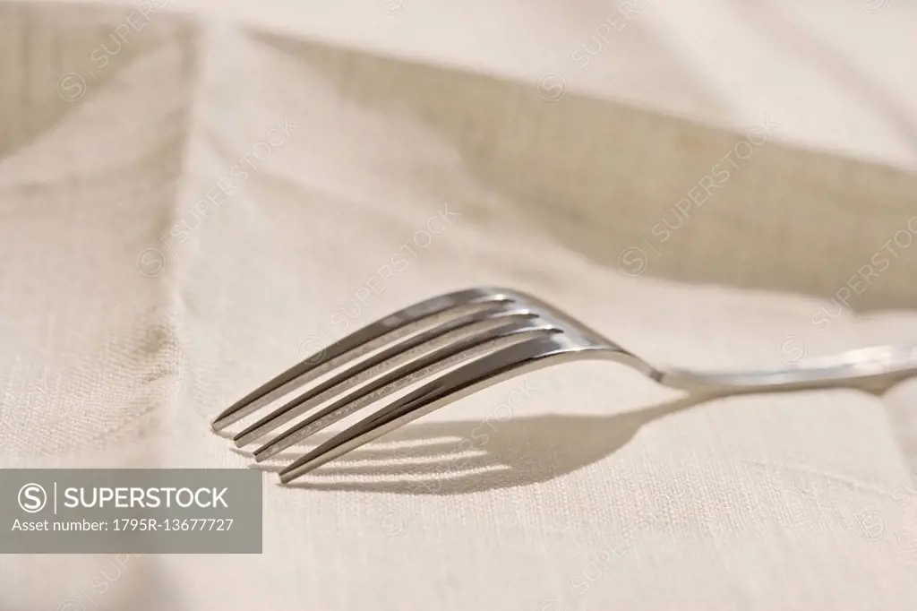 Closeup of metal fork on a napkin