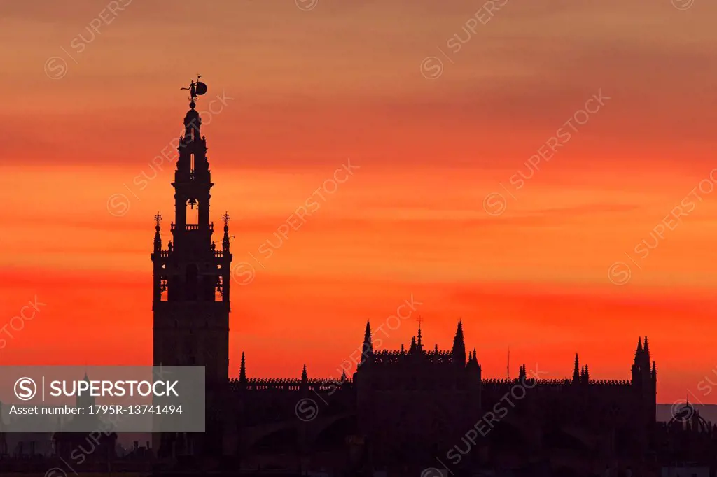 Spain, Seville, Silhouette of Giralda and Cathedral of Sevilla at sunset