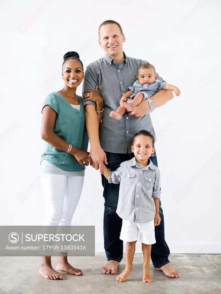 Portrait of family with two children (2-5 months, 2-3)
