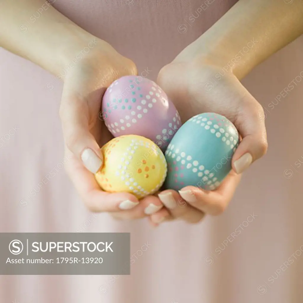 Woman holding decorated eggs