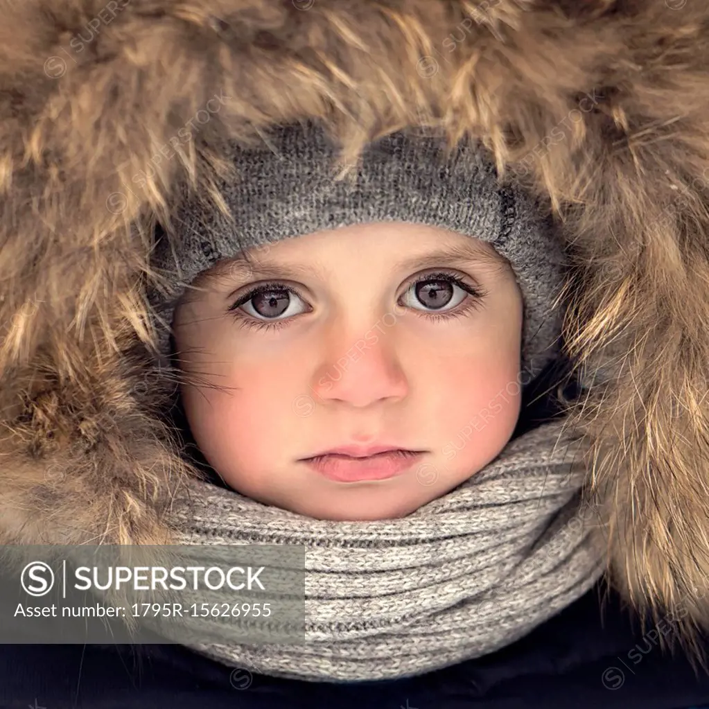 Boy with fur hood and scarf