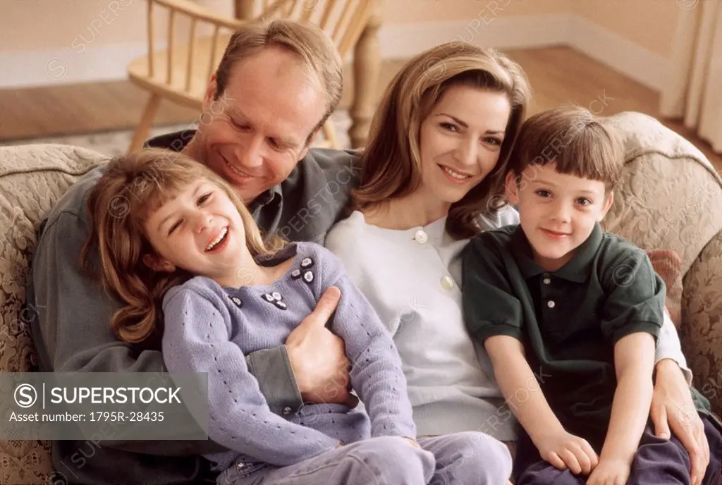 Family sitting together on the couch