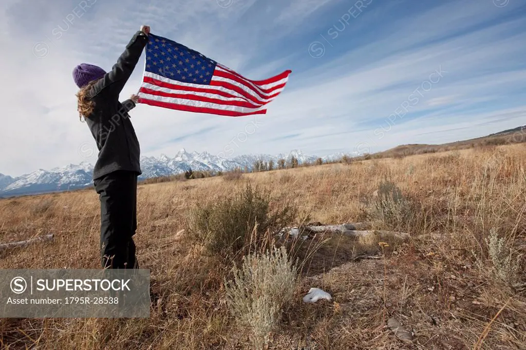 Hiker holding American flag