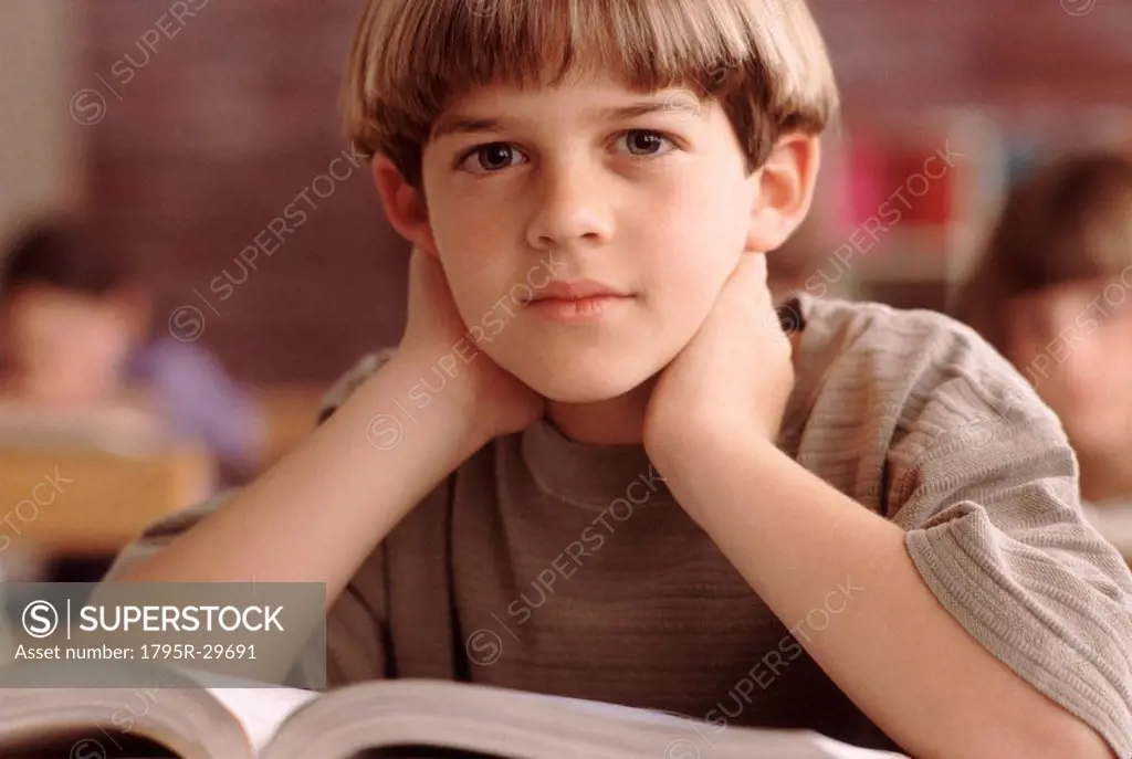 Elementary school student sitting at his desk