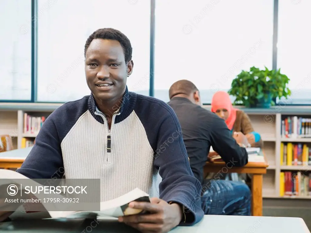 Adult sitting at desk at learning center