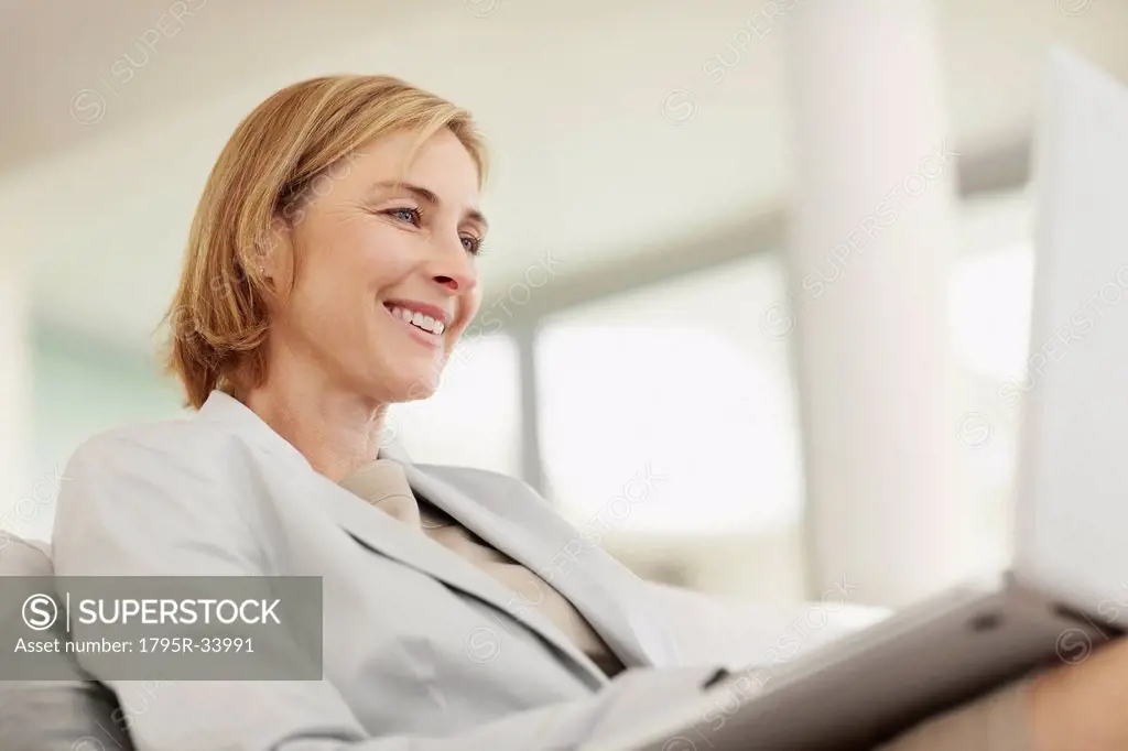 Mature business woman using laptop