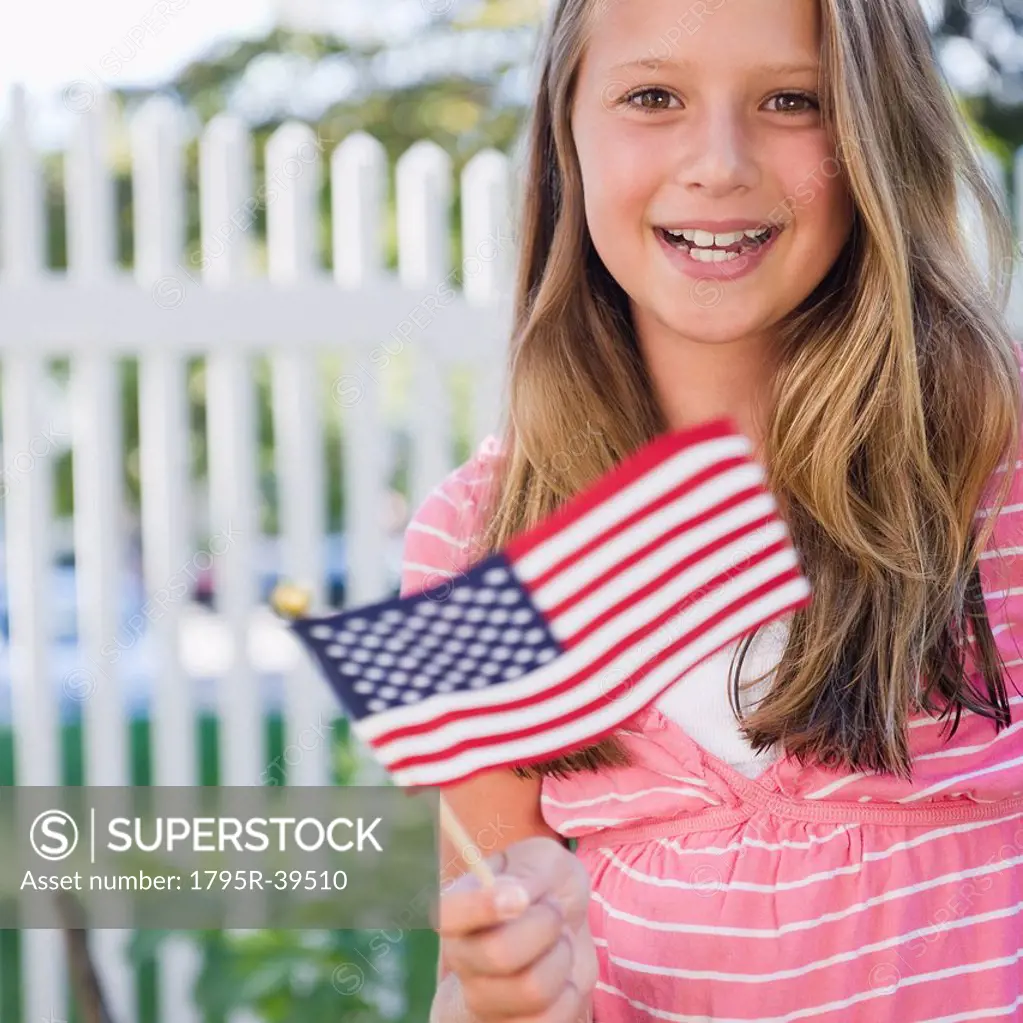 USA, New York, Girl 10_11 holding American flag