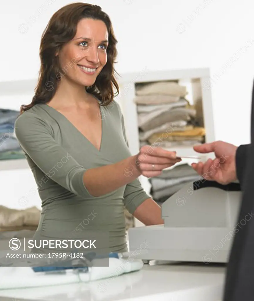 Female salesperson assisting male customer