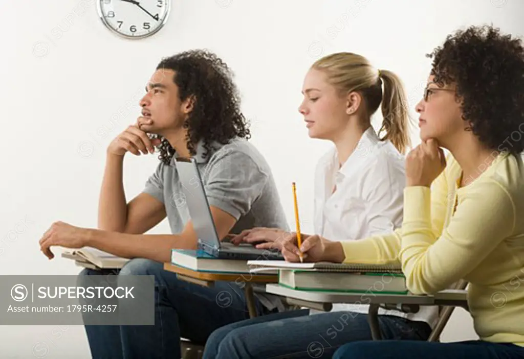 Three college students in class