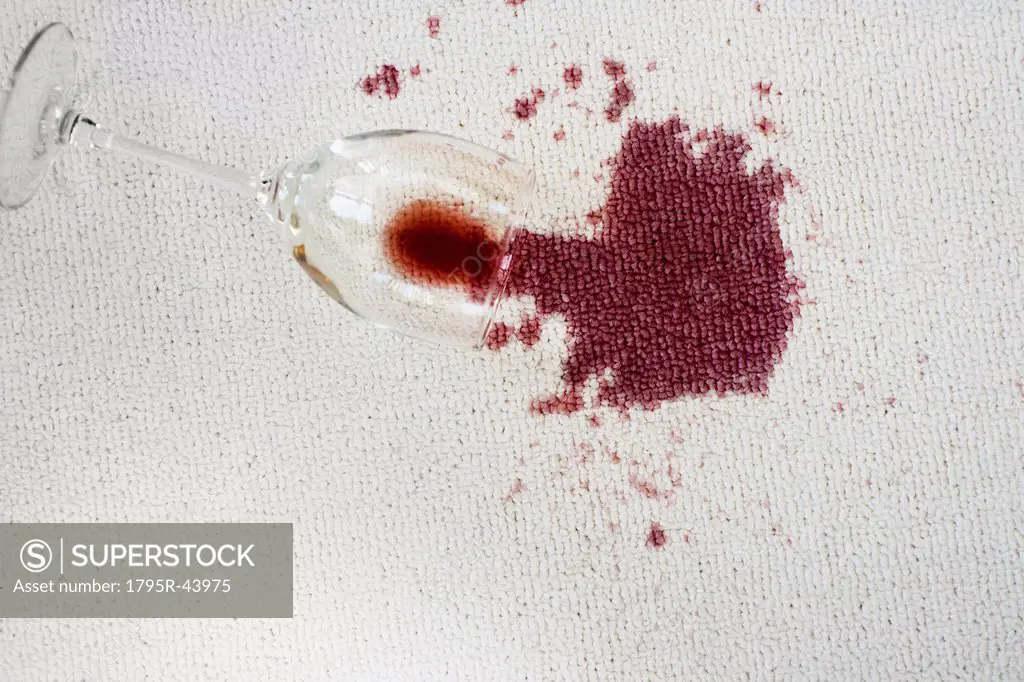 Close up of spoiled red wine on white background