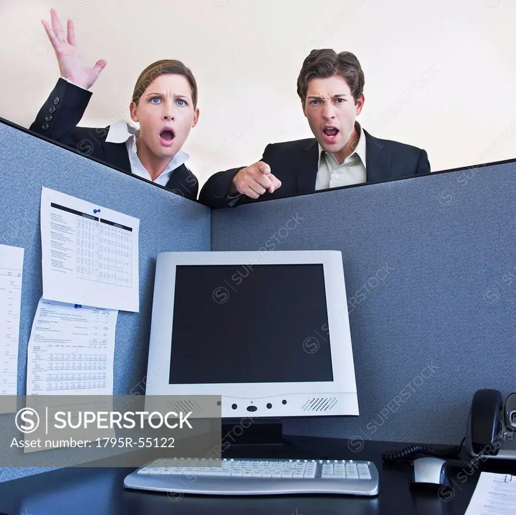 Office workers shouting in office cubicle