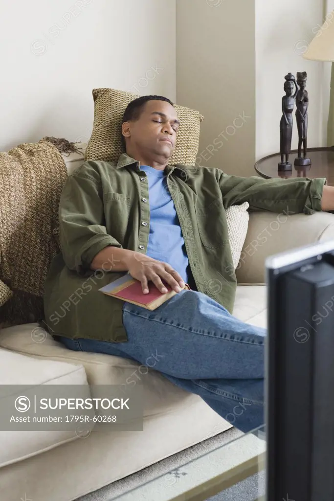 Man napping on sofa