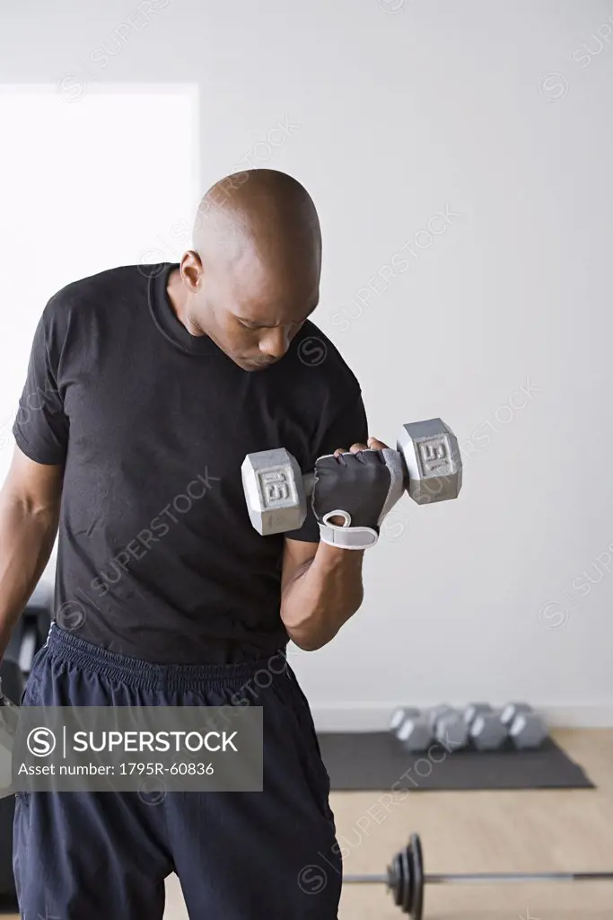 Man lifting dumbbells