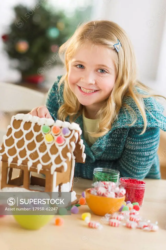 Girl 8__9 making gingerbread house