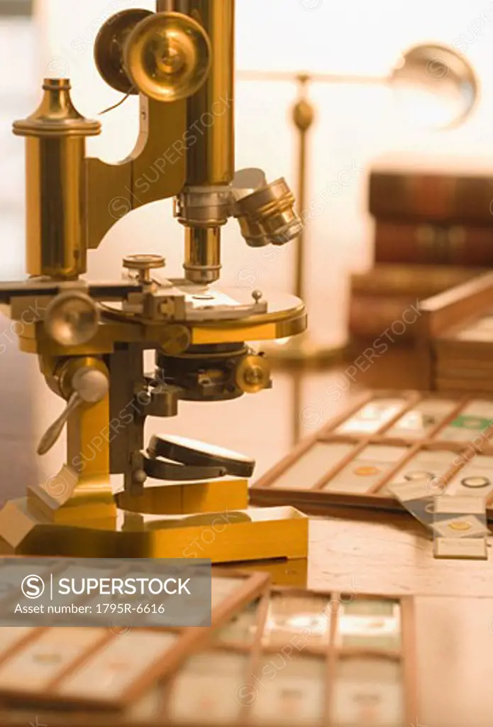 Old fashioned microscope and slides