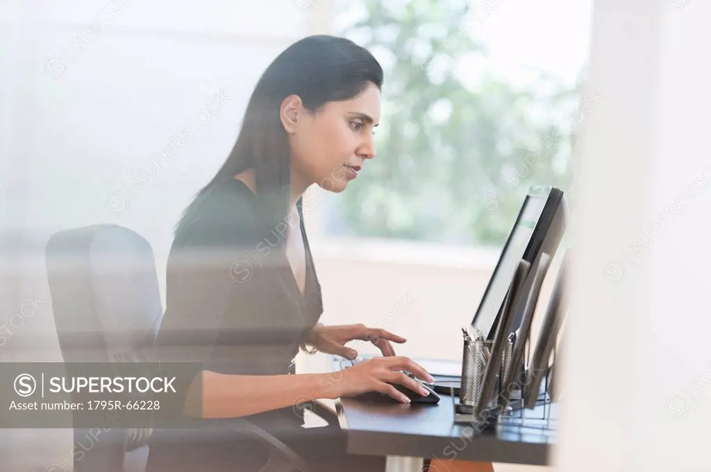 Businesswoman working on computer