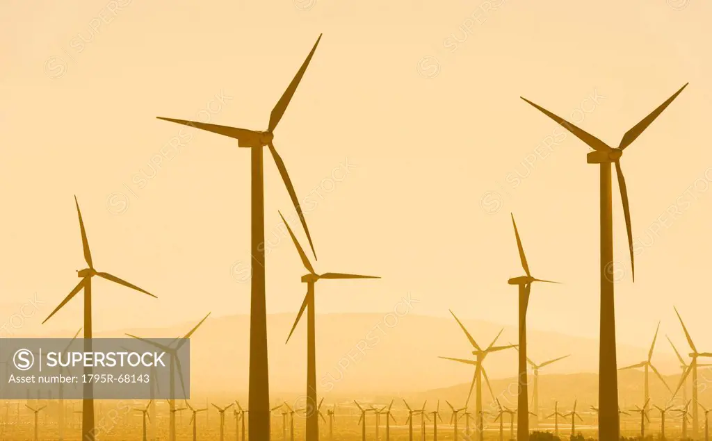 USA, California, Palm Springs, Wind turbine against sunset sky