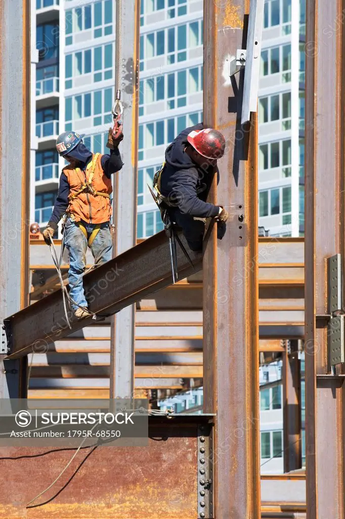 USA, New York, Long Island, New York City, Male workers on construction site