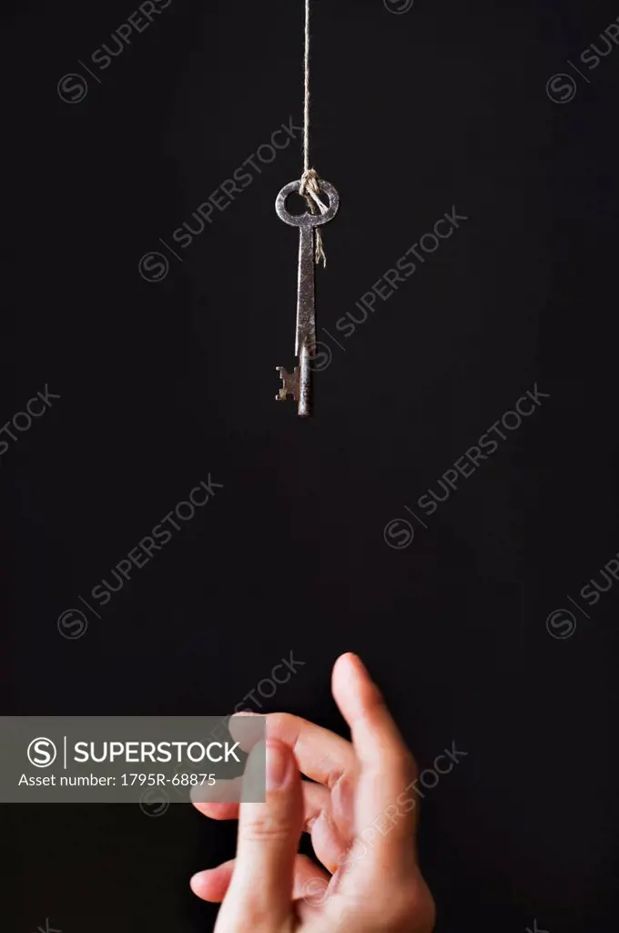 Hand reaching for key