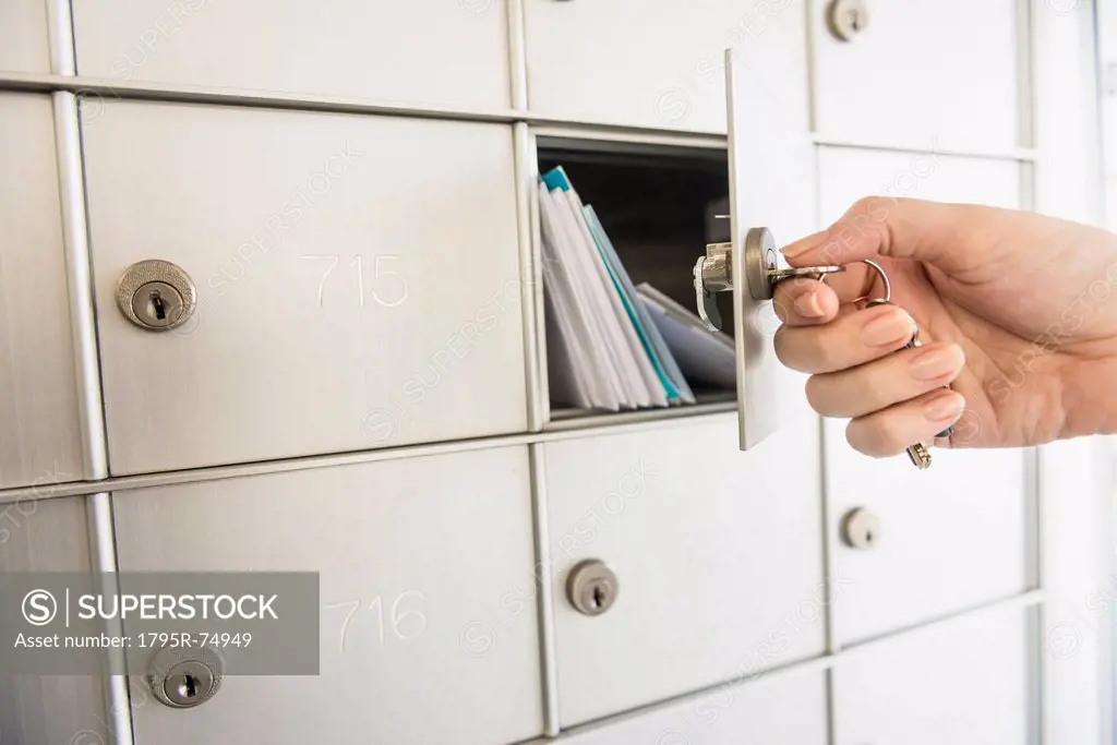 Woman closing safety deposit box