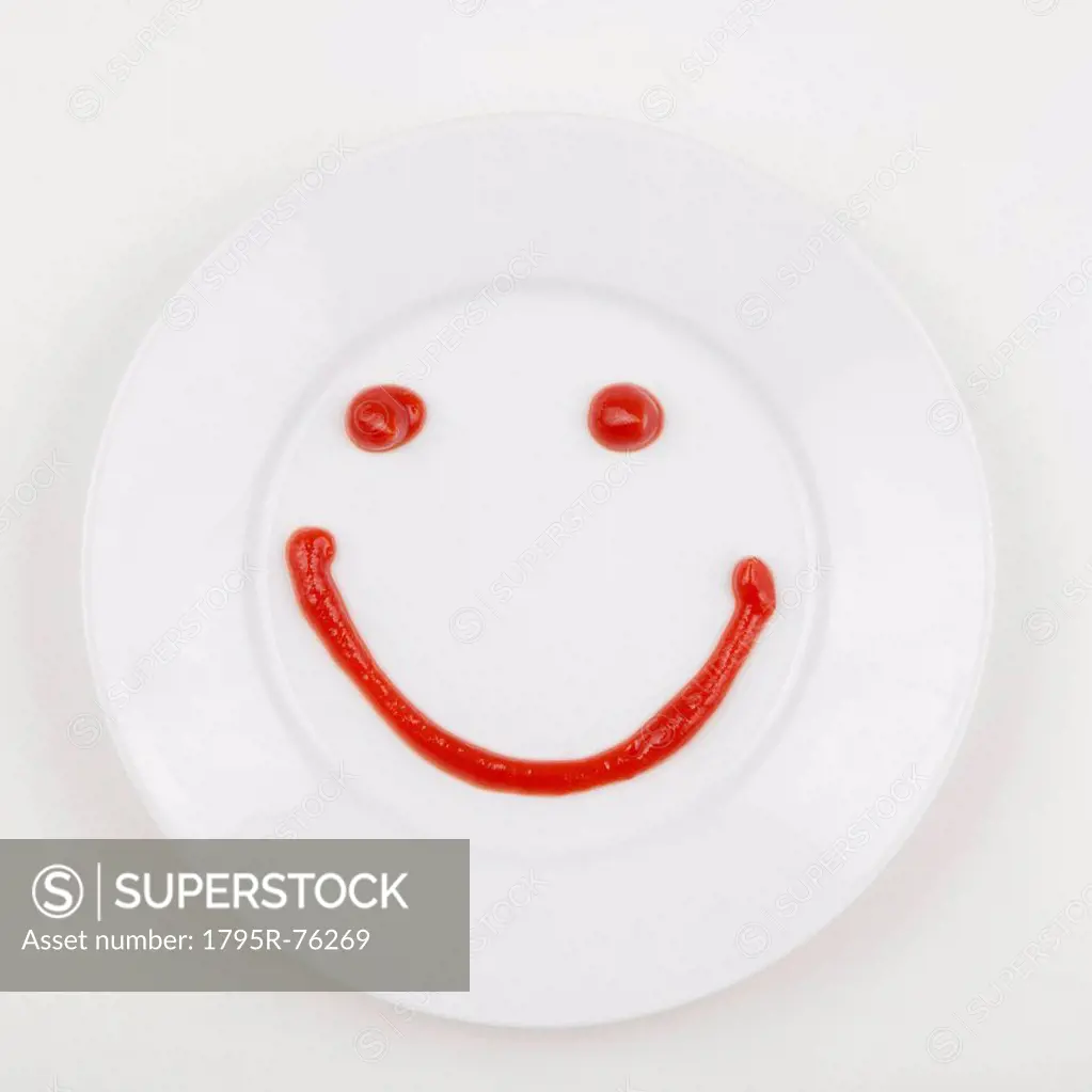 Plate with smiley face made of ketchup