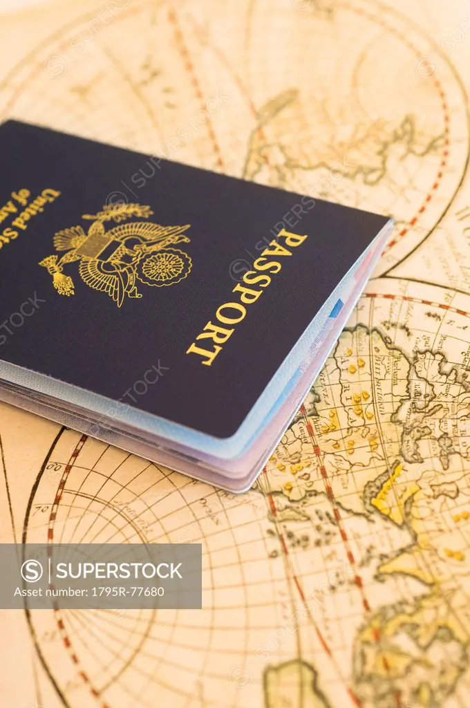 Passport sitting on antique map