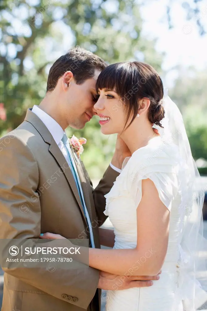 Portrait of young bride and groom