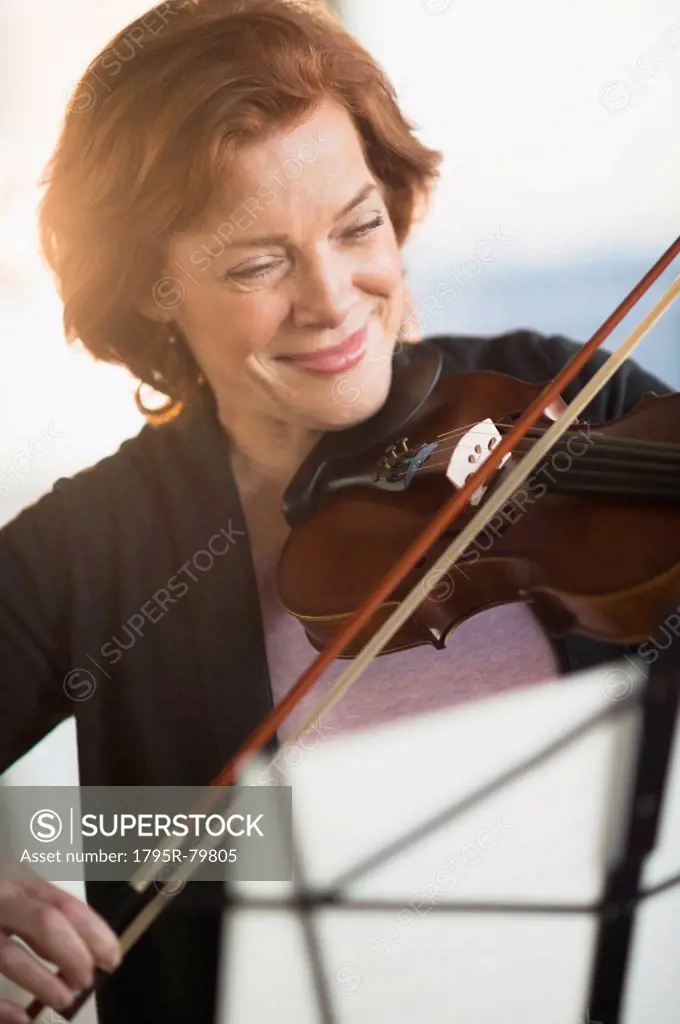 Senior woman playing violin