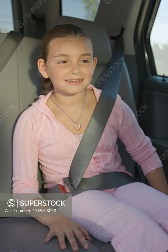 Girl sitting in backseat of car