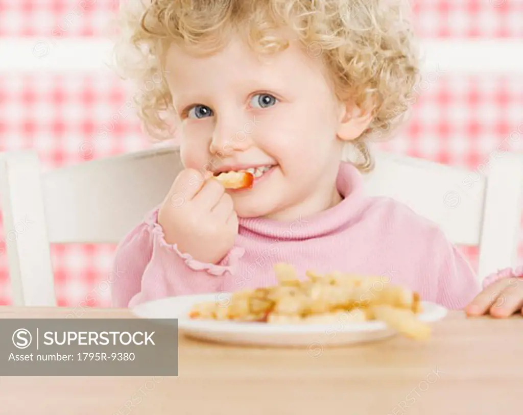 Female child eating French fries