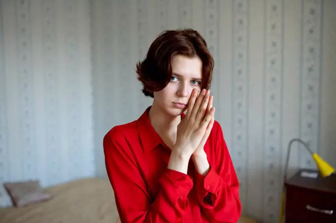 Portrait of young woman at home