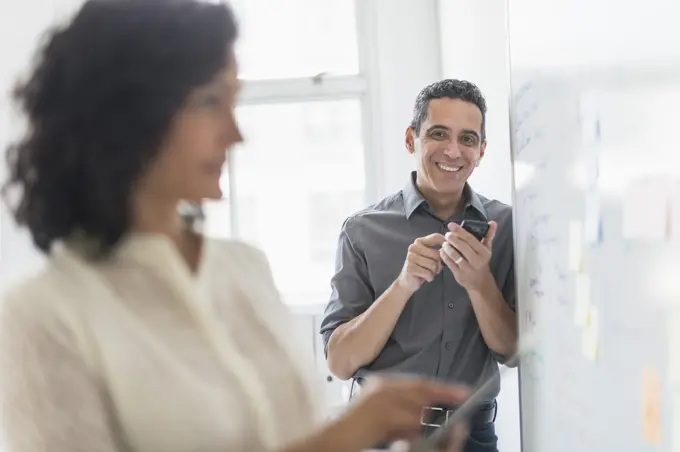 Man and woman working in office