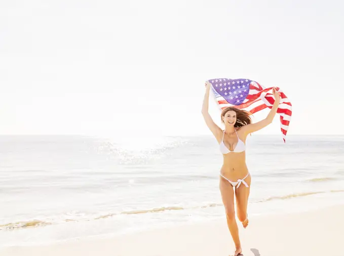 Woman holding American flag