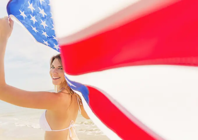 Woman holding American flag