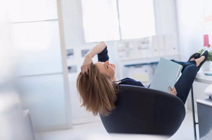 Business woman relaxing in office