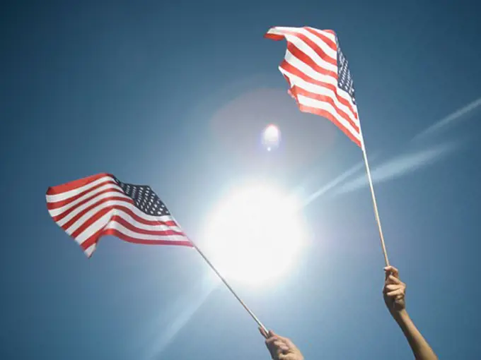 Woman holding American flags