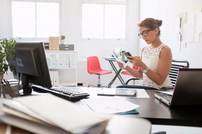 Young woman working in office