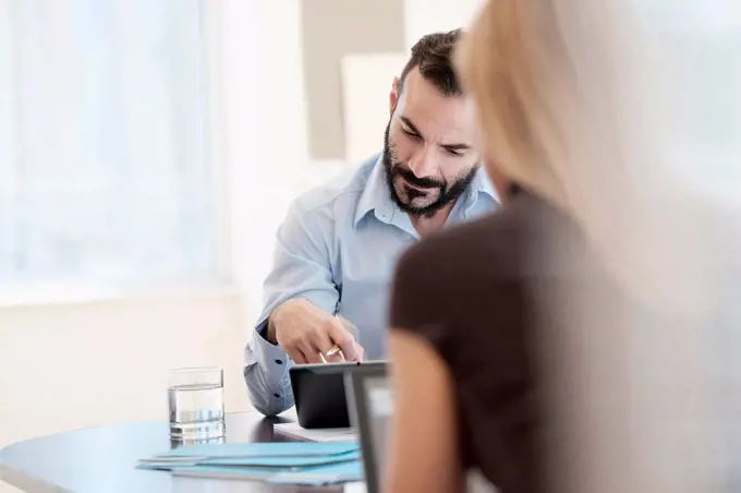 Man and woman working in office