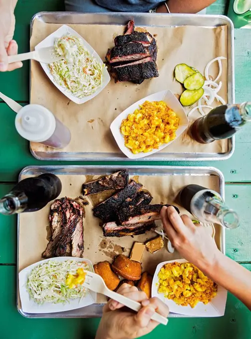 Friends eating barbecue food