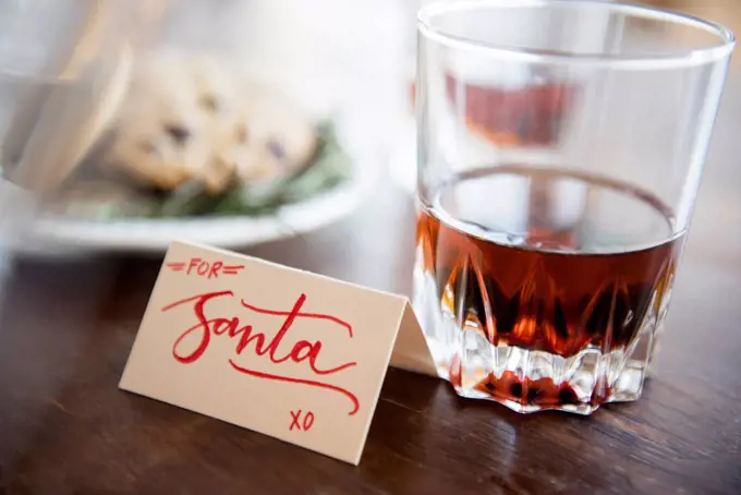 Manhattan drink and cookies on table during Christmas