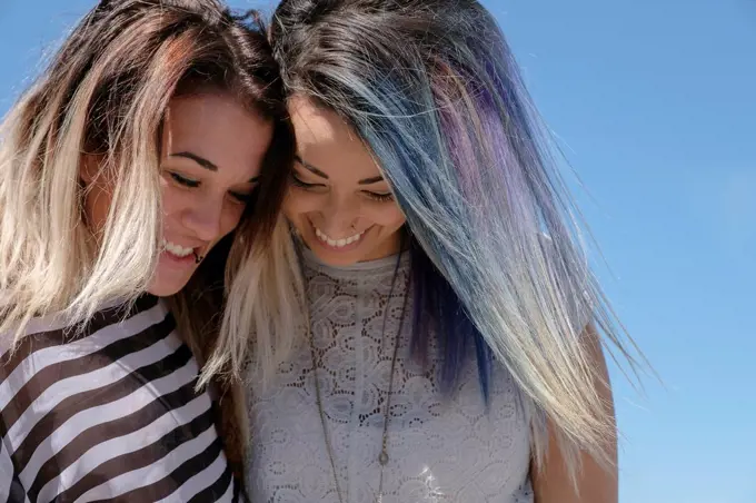 Smiling young women looking down