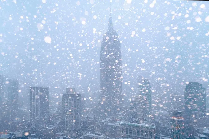 USA, New York State, New York City, Empire State Building and city skyline in snow