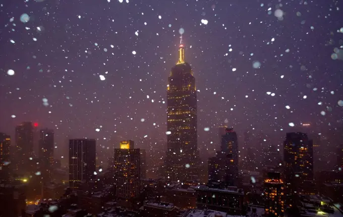 USA, New York State, New York City, Empire State Building and city skyline in snow