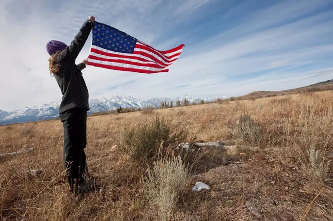 Hiker holding American flag