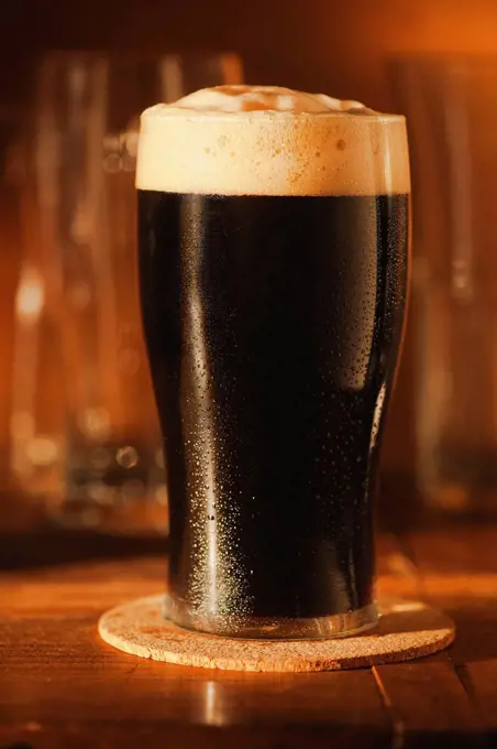 Ale in beer glass on bar counter