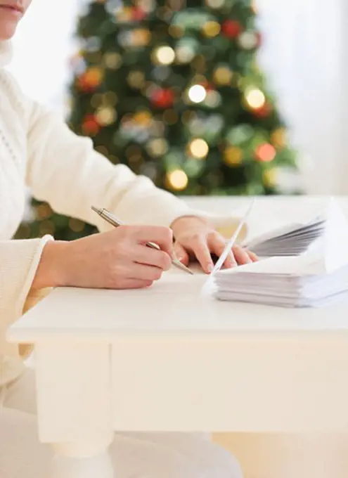 Woman writing Christmas cards