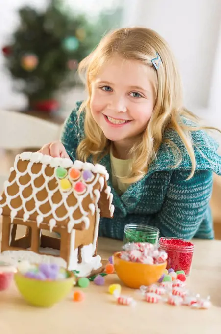 Girl 8__9 making gingerbread house