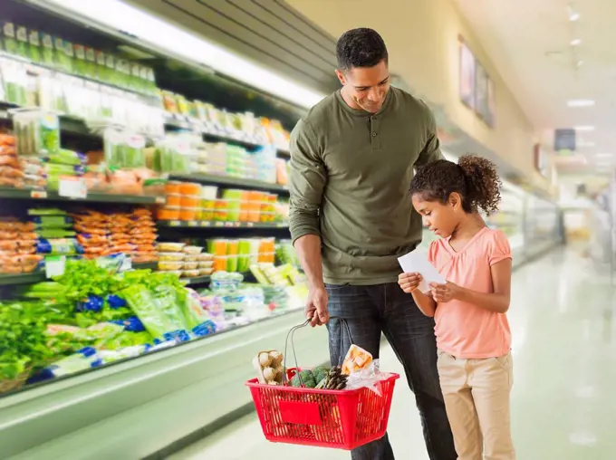 Father with daughter 6_7 shopping in supermarket